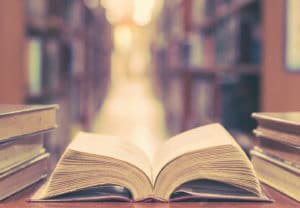 Anthropology College Major - Old book lays open on a library table