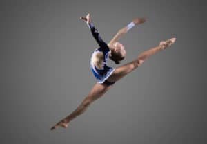 Dance College Major - Woman ballet dancer dramatically leaping in air