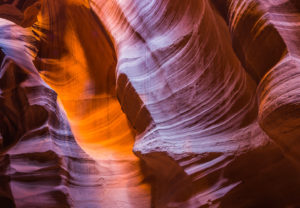 Dramatic geological rock formation of orange and purple sandstone