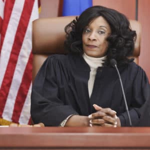 Judge sitting in court room