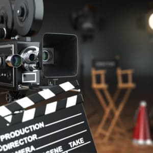 Producer and Director Careers - Slate board on a darkened film production set