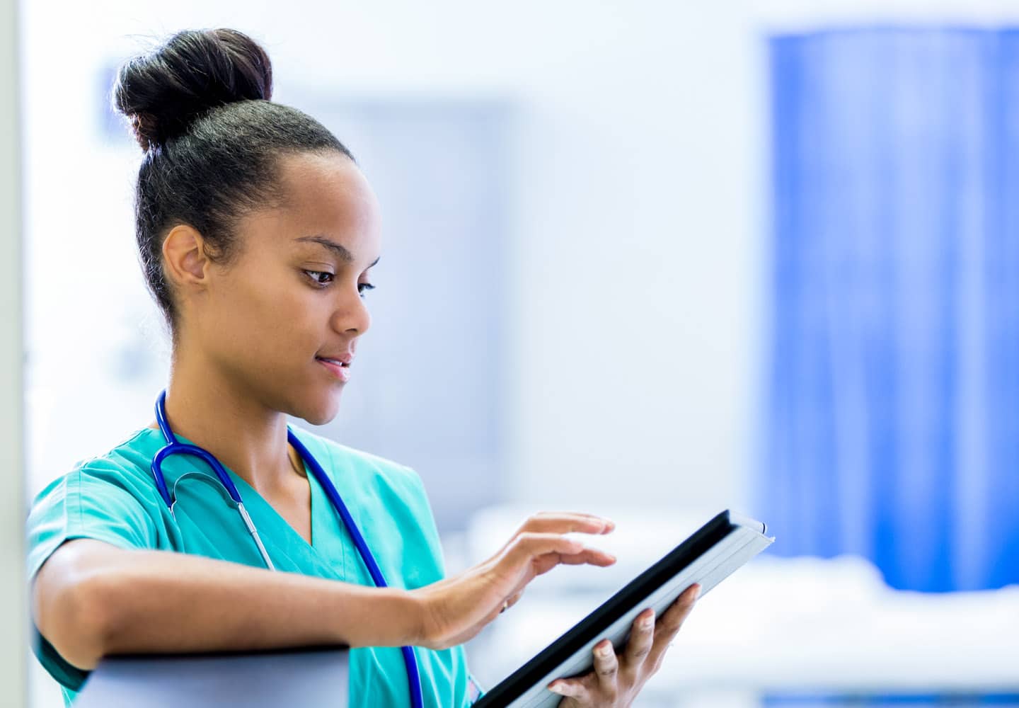 Nursing major reading a patient's chart
