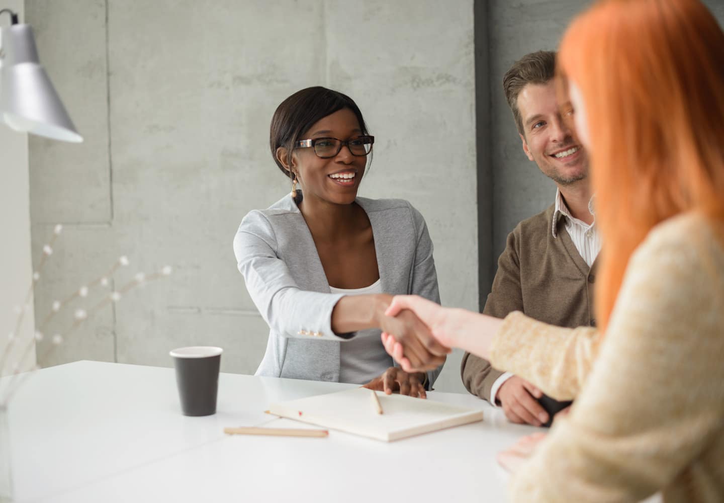 Female Human Resources manager introduces herself to new employees
