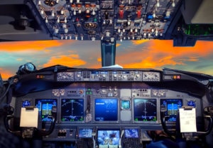 Aviation cockpit with evening sunset clouds