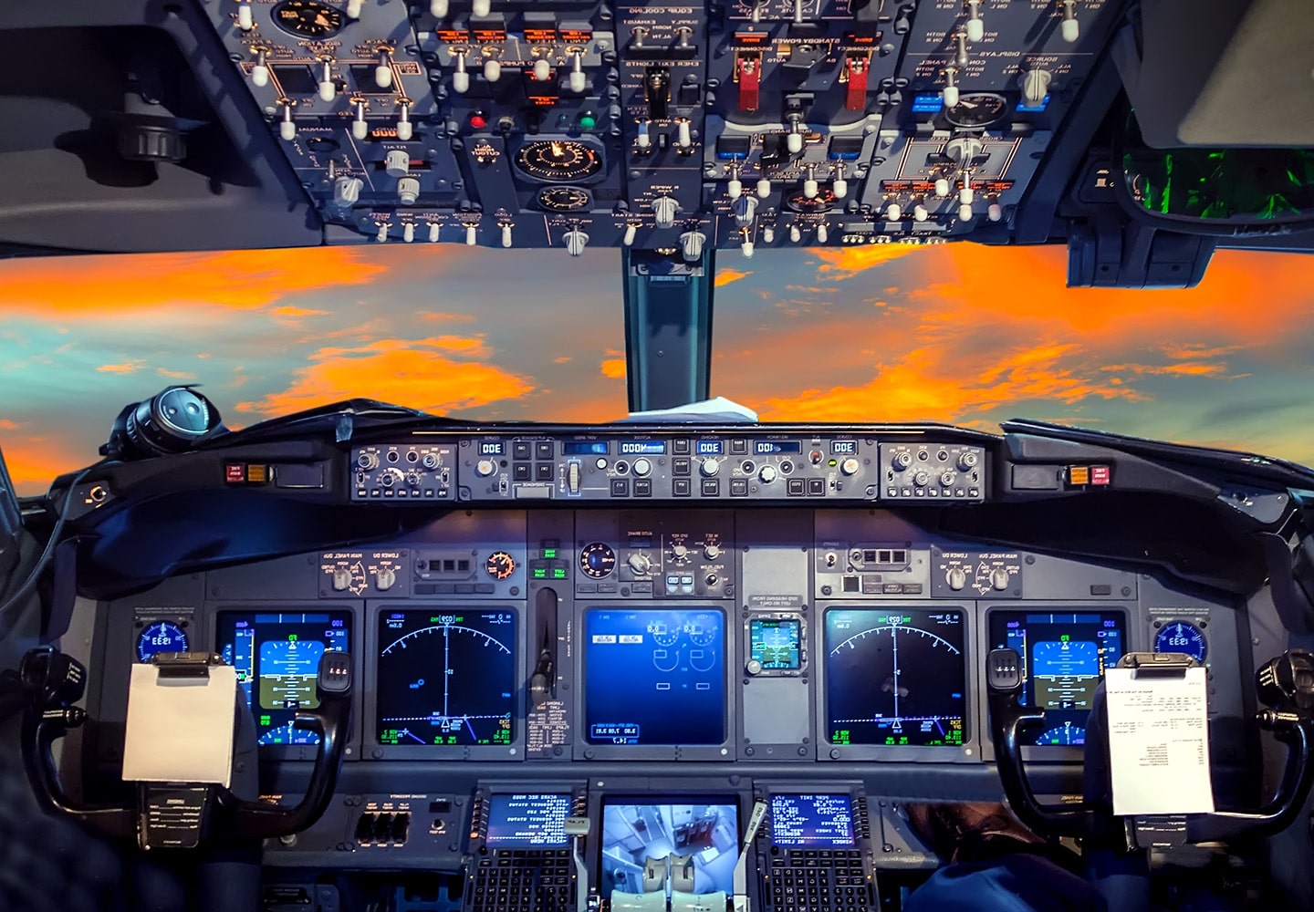 Aviation cockpit with evening sunset clouds