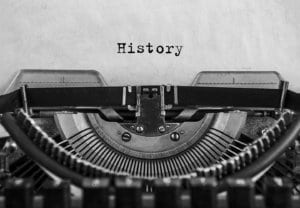 History typed on a sheet of paper in an old fashioned typewriter