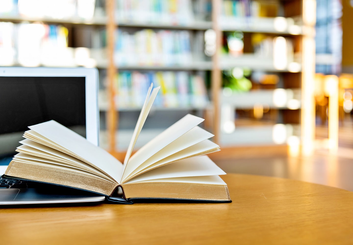 Liberal Arts book open on a table in a contemporary library