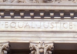 Social Justice image of Supreme Court building with Equal Justice carved into the stone facade