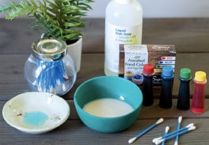 Color changing milk activity with bowl and other supplies
