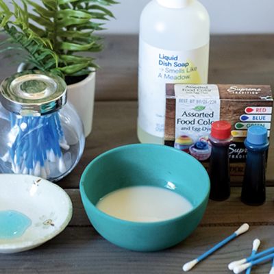 Color changing milk activity with bowl and other supplies