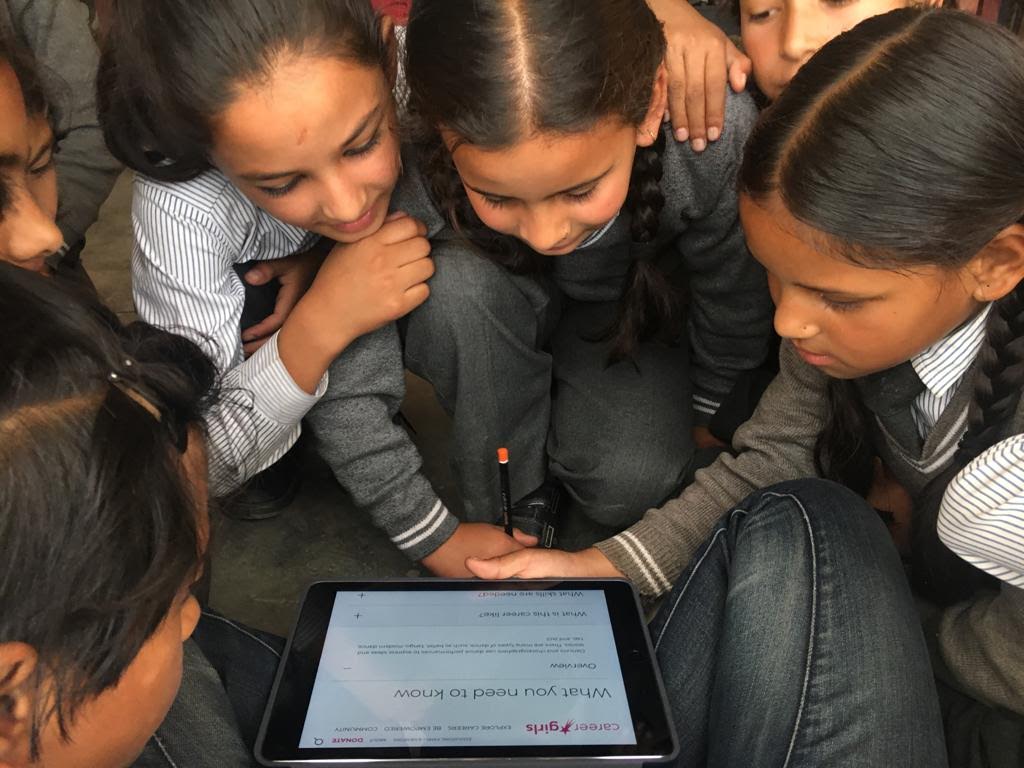 Girls around the world exploring Career Girls website on tablet