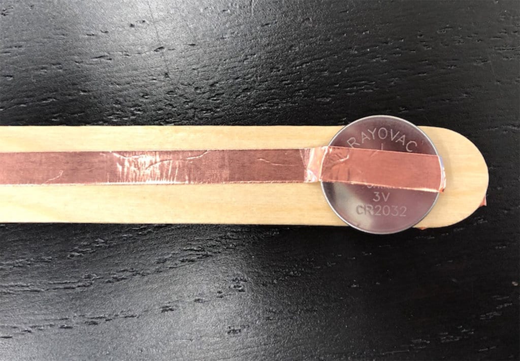 DIY light switch activity photo step one with wood stick copper strip and penny