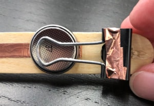 DIY light switch activity photo step two with wood stick copper strip and penny