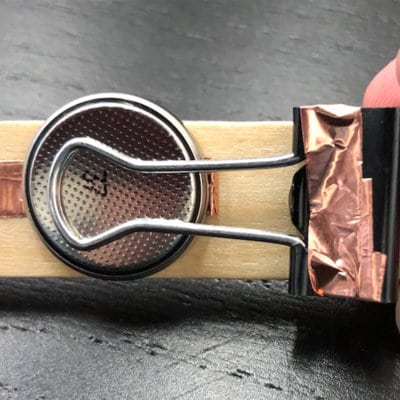 DIY light switch activity photo step two with wood stick copper strip and penny