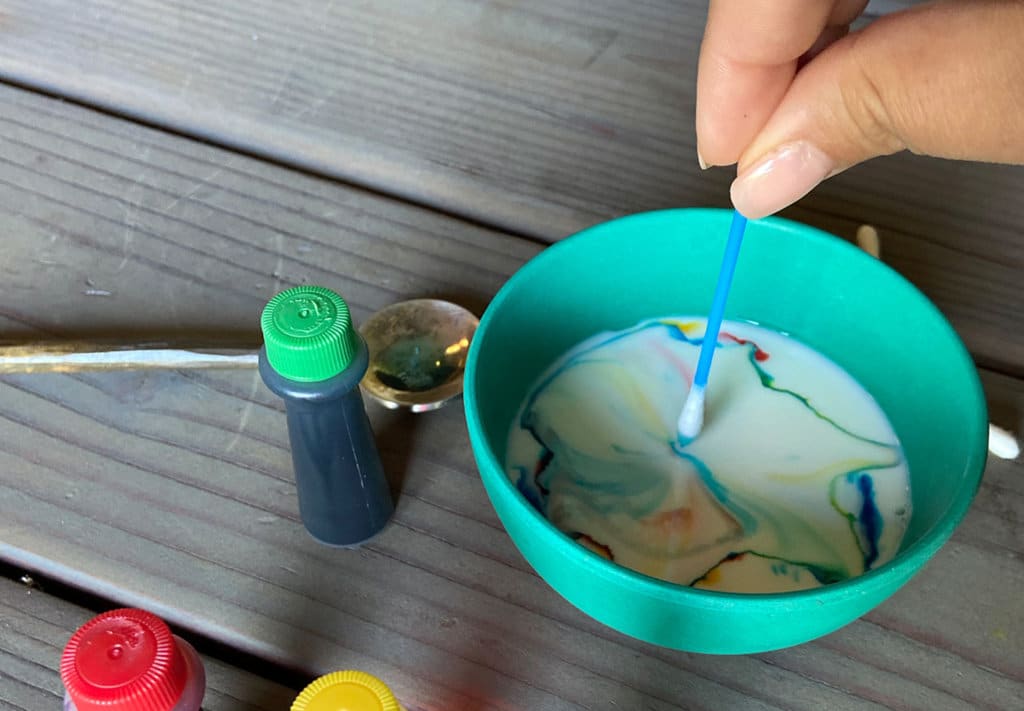 Color changing milk step two with food dye color mixing