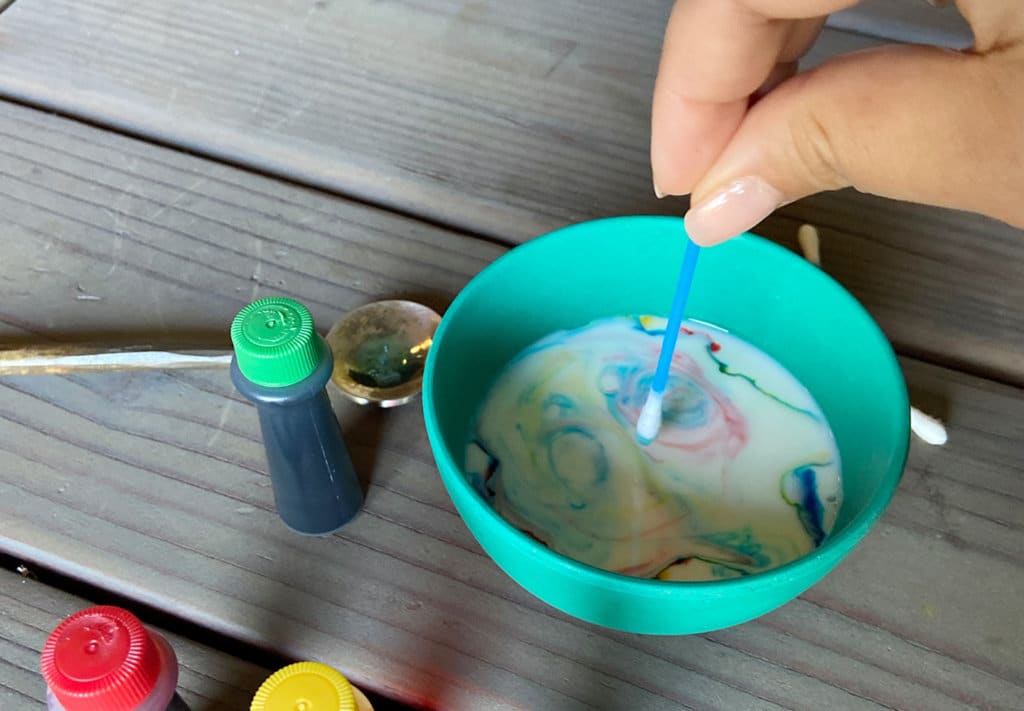 Color changing milk step three with food dye color mixing