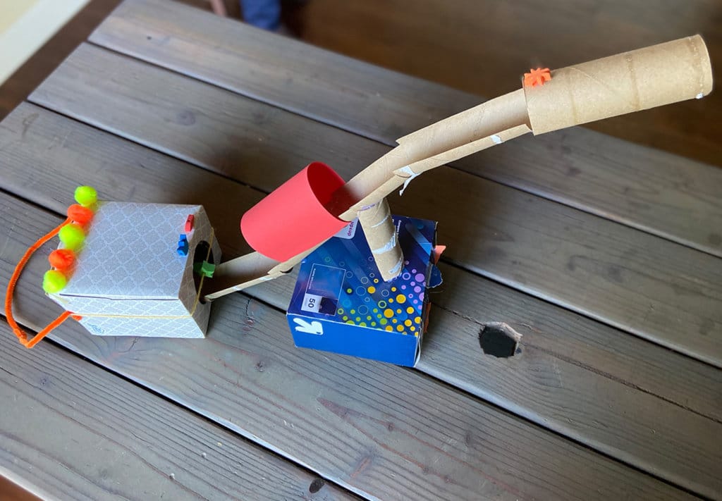 Obstacle course activity finished example of cardboard tube with white ping pong ball