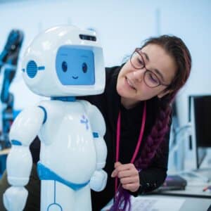 Dr. Kate Tsui, Manager of the Human-Robot Interaction Research group at Toyota Research Institute, working with a robot.