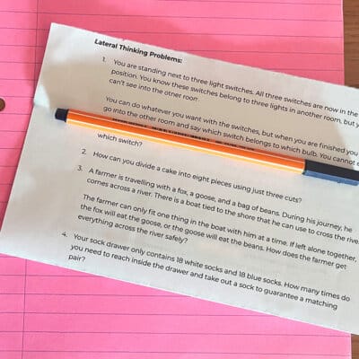 Lateral Thinking Problem Empowerment Activity image of notebook, pen and printed answers