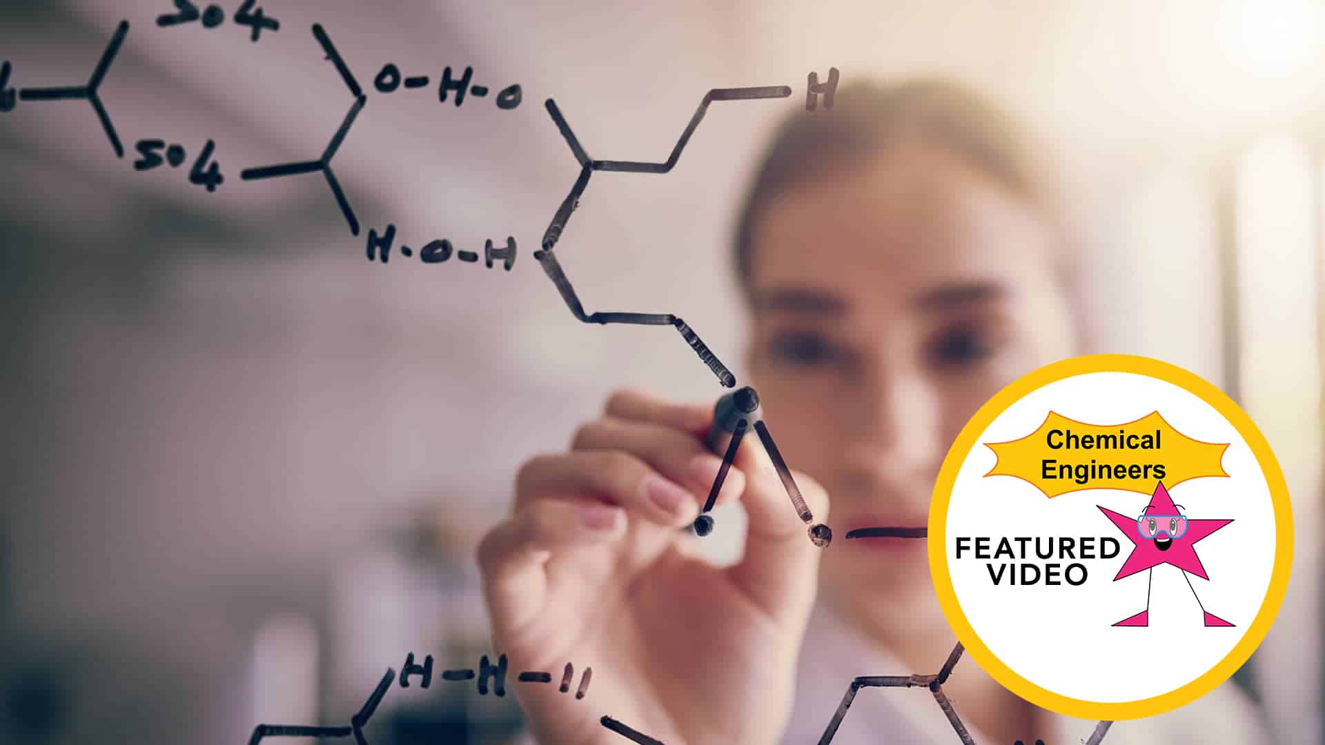 Chemical engineer writing on glass wall