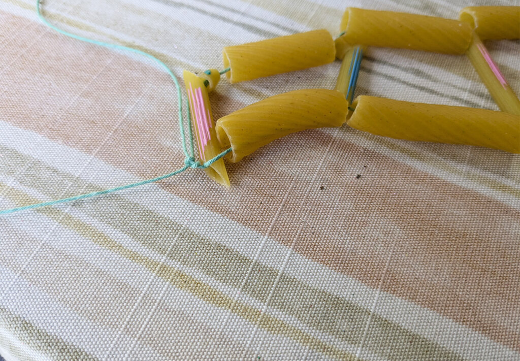 Genetics Empowerment Video Group Activity - Genetics DNA Model From Pasta - tie off the end string