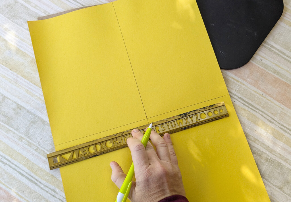 Draw lines bisecting the paper horizontally and vertically