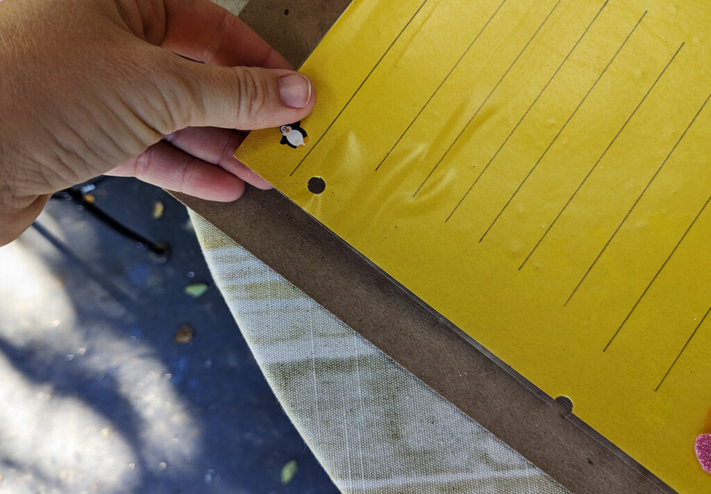 Punch a hole in the top corner