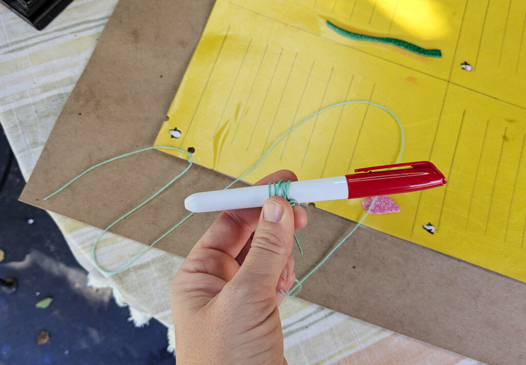 Attach the pen to the top do list with a string
