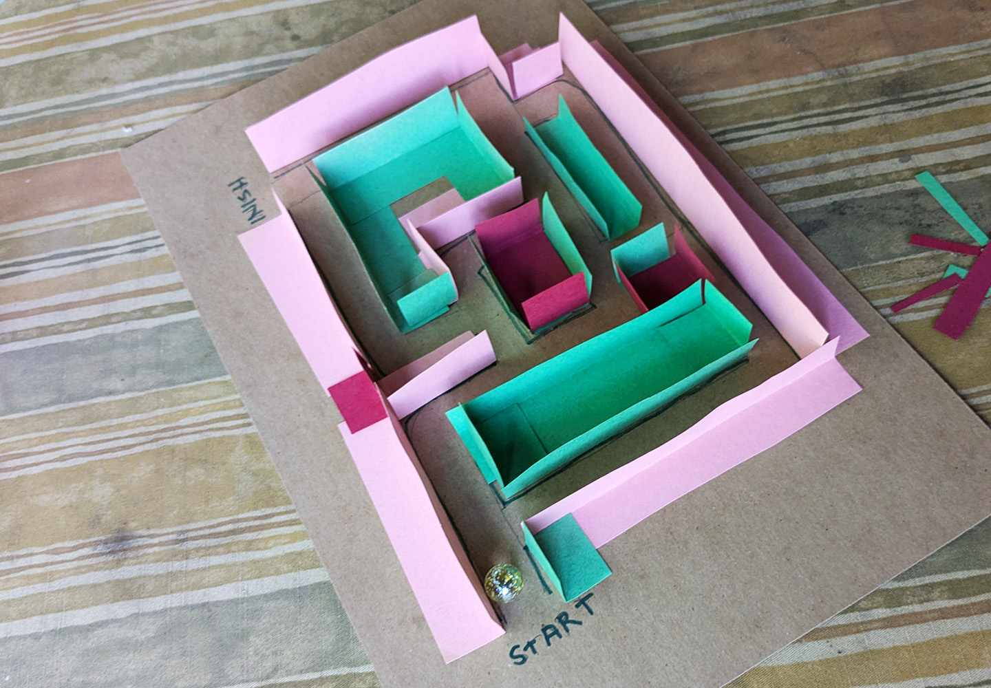 Miniature maze activity - finished maze with marble